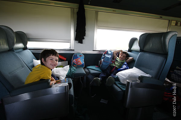 young boys travelling on a train across Canada